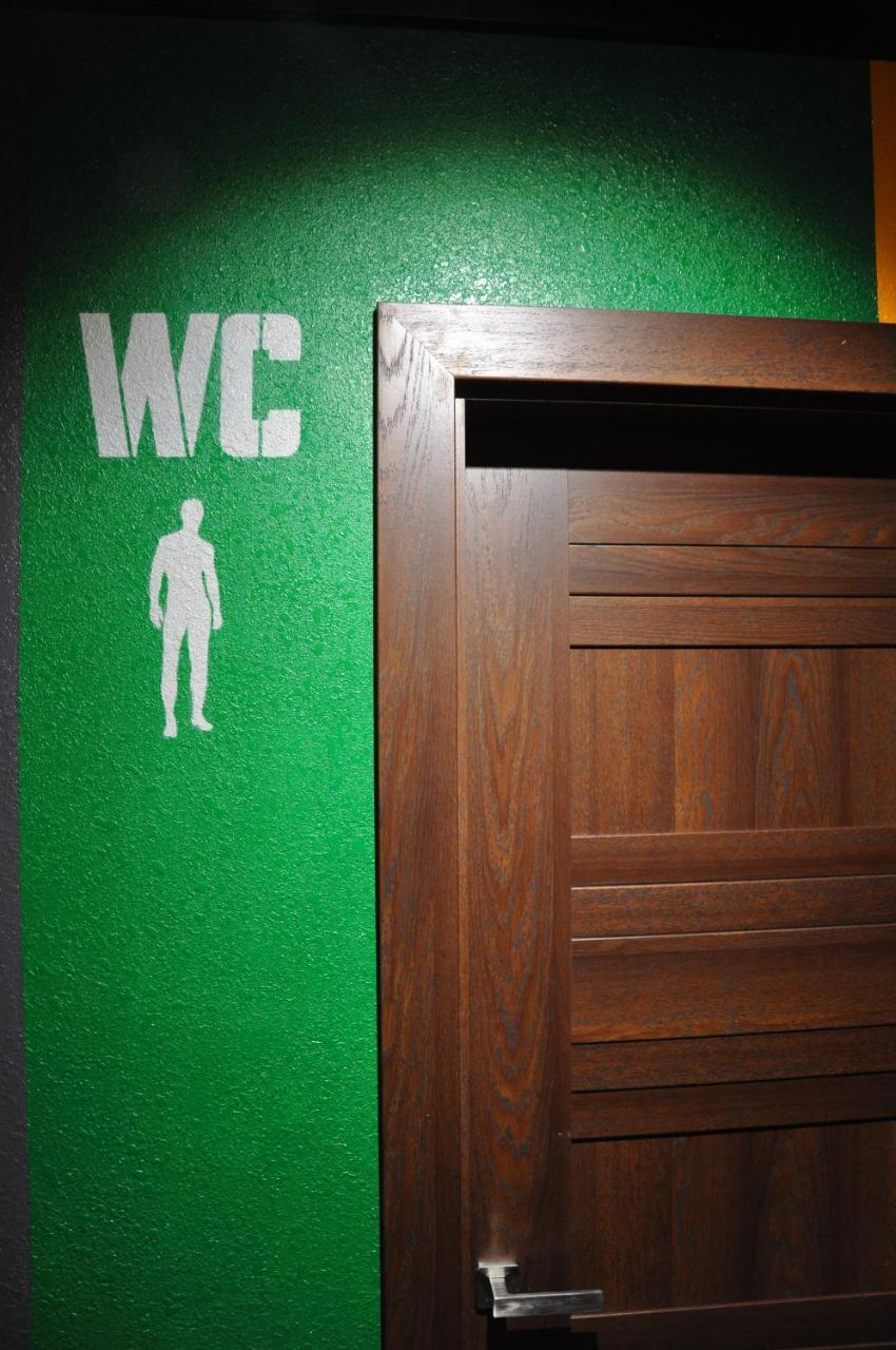 Full House Capsule Hostel Rivne Exterior photo A sign for a men's toilet